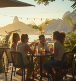 Guests enjoy a leisurely afternoon at Terrazza Garden in Lagoa, Rio, with views of the lagoon, savoring drinks and conversations in the golden sunlight.