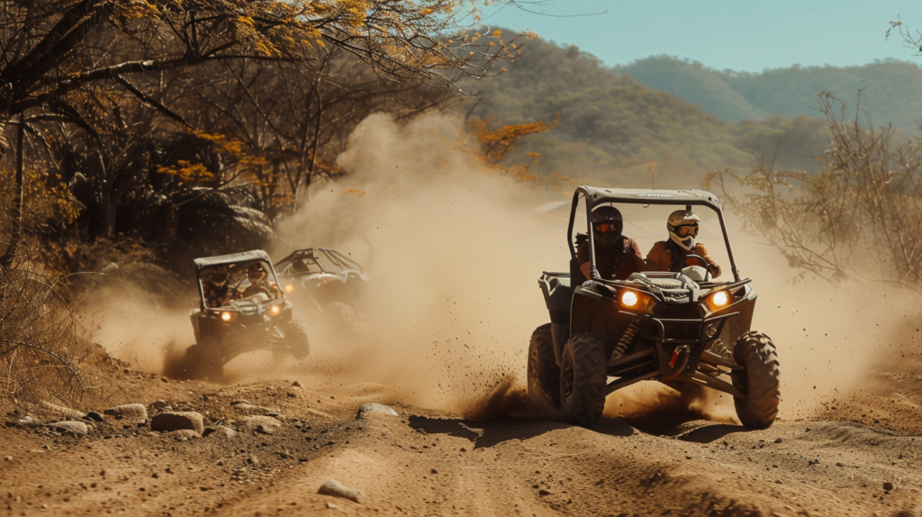 A group of tourists on ATVs kicking up dust while navigating the rugged dirt trails of the Sierra Madre near Puerto Vallarta.