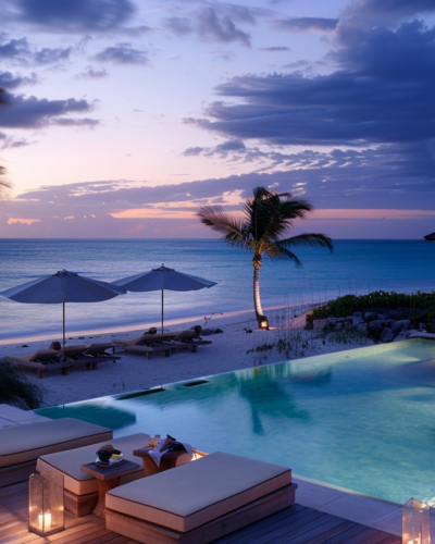 A luxurious beachfront resort with cabanas and guests enjoying sunset cocktails in Turks and Caicos.
