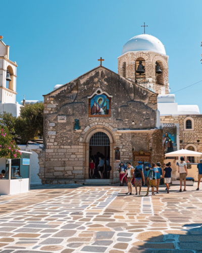 The historical Panagia Ekatontapiliani church in Parikia, Paros, with intricate architecture and tourists admiring the site.